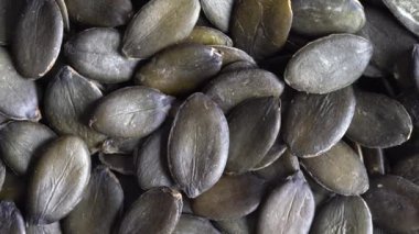 Yeşil kabak tohumlarının makro arkaplan dokusu, kapat, üst görünüm, döndürür