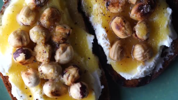 Two Bread Toast Cream Cheese Roasted Hazelnuts Honey Pepper Salt — Stock Video