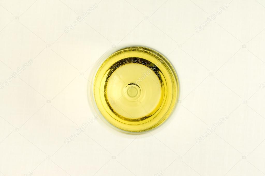 A glass of white wine from above.