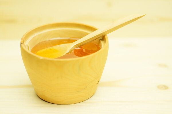 Honey in a wooden bowl