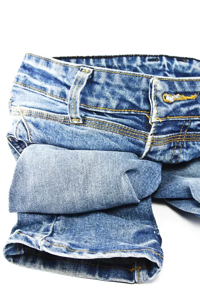 Niebieskie Spodnie jeansowe na białym tle — Zdjęcie stockowe