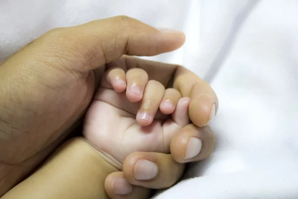 Man holding a baby hand — Stock Photo, Image