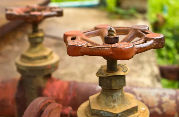 Old water pipes and valves — Stock Photo, Image