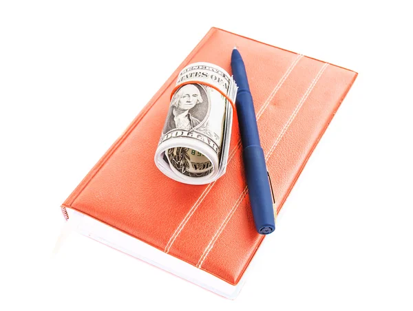 Boek, dollars en pen op een witte achtergrond — Stockfoto
