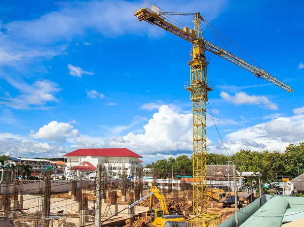 Yellow crane in a construction site — Stock Photo, Image