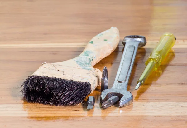 Paint brush,Screwdrivers and wrenches on wood background — Stock Photo, Image