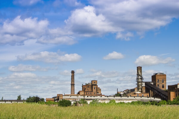 Old abandoned factory under blue sky