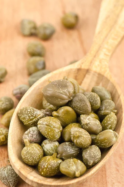 Capers in spoon — Stock Photo, Image