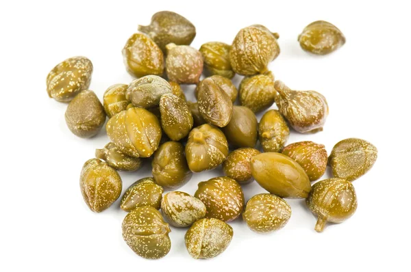 Heap of capers on white — Stock Photo, Image