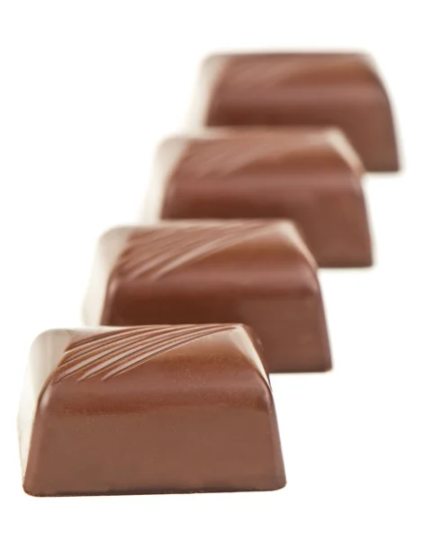 Patru ciocolate pe alb — Fotografie, imagine de stoc
