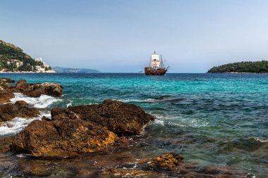 old retro sail ship floats on the sea