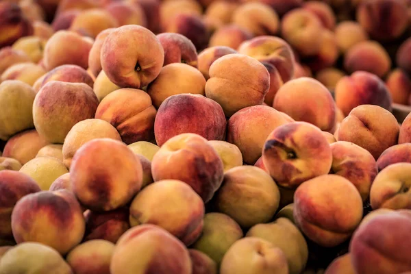 heap of ripe sweet peaches