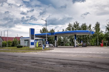 Empty gas station under cloudy sky. Transportation theme. Fuel crisis
