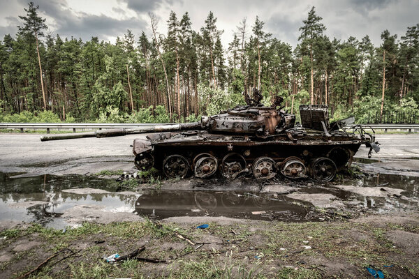 Wrecked burned russian tank in Ukraine. Russian aggression in Ukraine