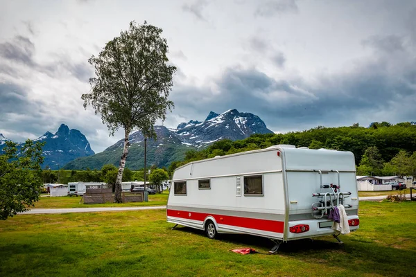 Caravan camper trailer in a relaxing nature camp site. Norway