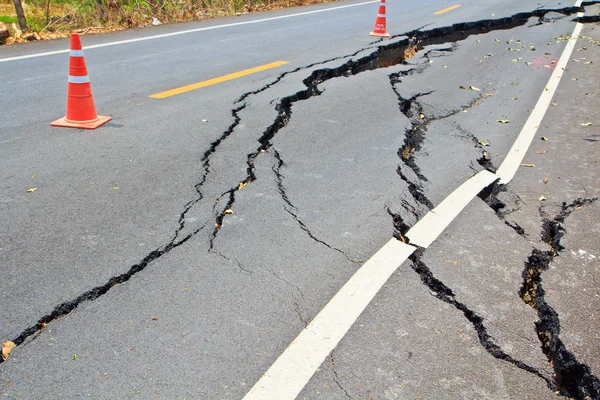 Cracked surface of an asphalt road — Stock Photo, Image