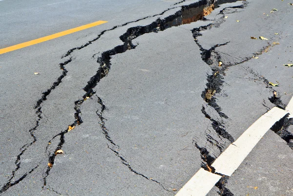 Cracked surface of an asphalt road — Stock Photo, Image
