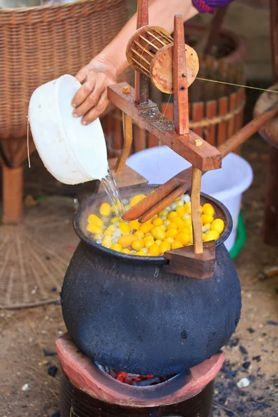 Boiling cocoon in a pot — Stock Photo, Image