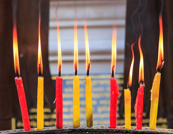 Lighting prayer candle — Stock Photo, Image