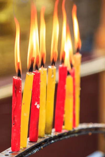 Lighting prayer candle — Stock Photo, Image