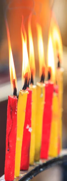 Lighting prayer candle — Stock Photo, Image