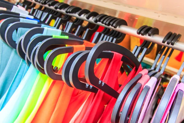 Clothes hang on a shelf — Stock Photo, Image