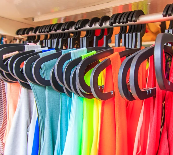 Clothes hang on a shelf — Stock Photo, Image