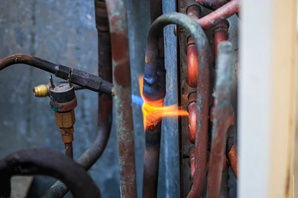 Welding copper pipes — Stock Photo, Image