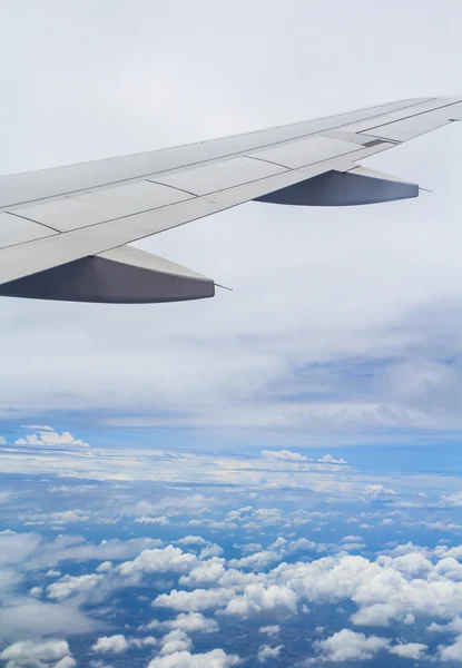 Airplane wing out of window — Stock Photo, Image