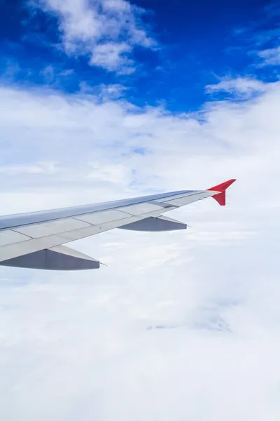 Airplane wing out of window — Stock Photo, Image