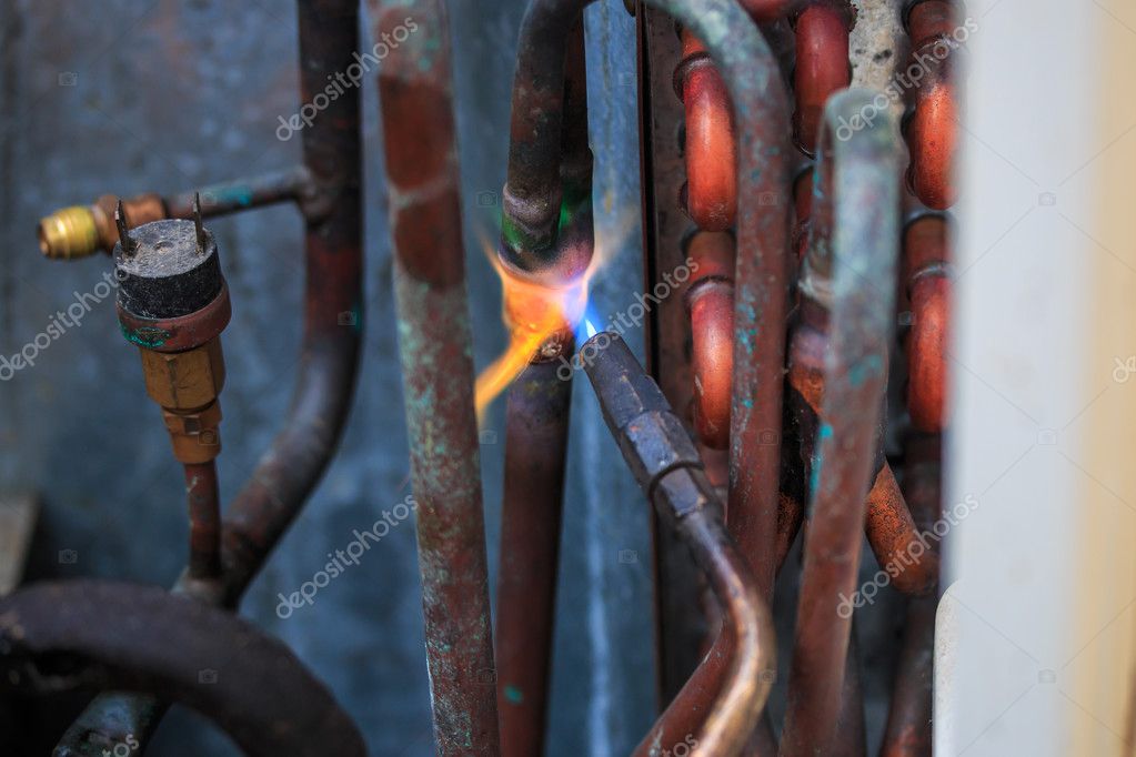 Welding copper pipes Stock Photo by ©Deerphoto 37405671