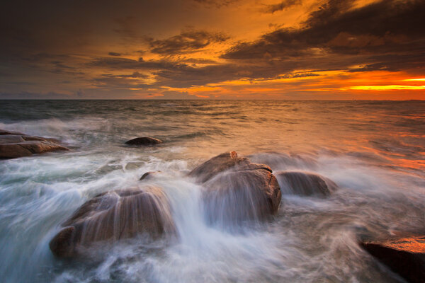 Sunset over sea rocks