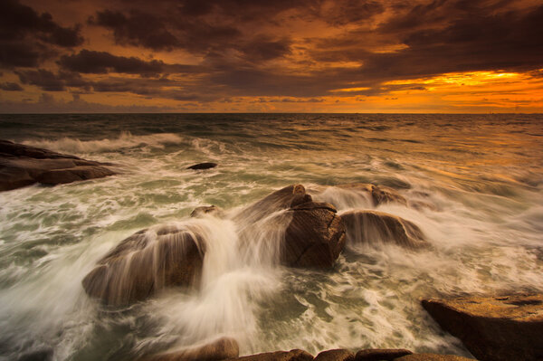 Sunset over sea rocks