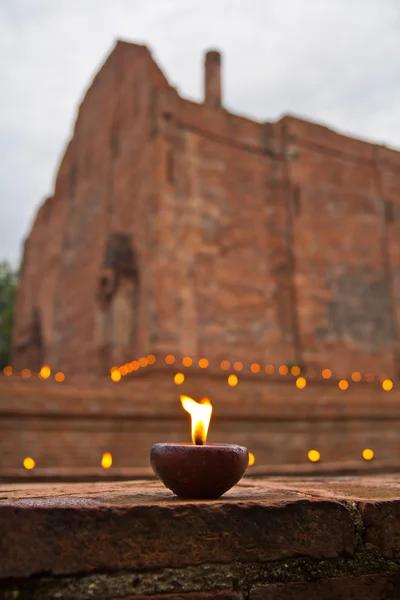 Candle lit Old Thai temple — Stock Photo, Image