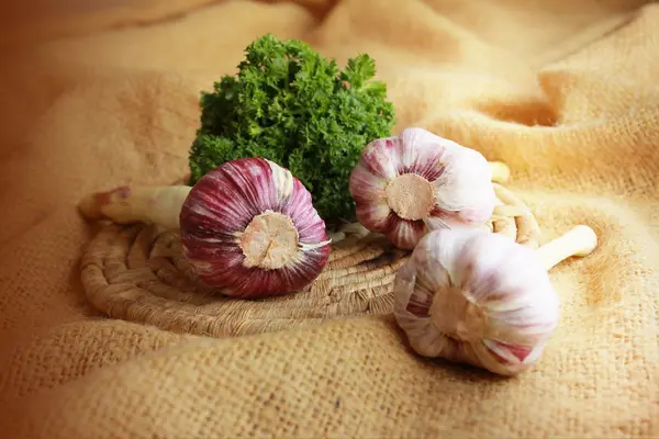 Pink garlic on a plate — Stock Photo, Image