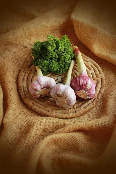 Pink garlic on a plate — Stock Photo, Image