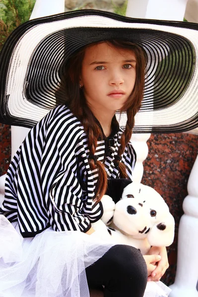 Little girl in a retro style with a soft toy — Stock Photo, Image