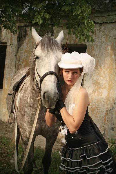 Girl dressed as Amazons and horseback — Stock Photo, Image
