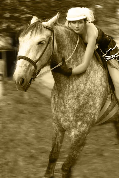 Girl dressed as Amazons and horseback Royalty Free Stock Photos