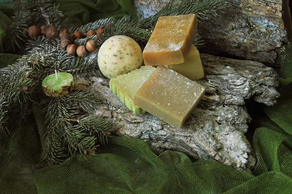 Handmade soap on the bark and twigs of trees — Stock Photo, Image