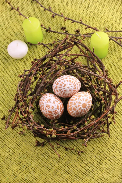 Easter composition with eggs and candles — Stock Photo, Image