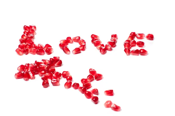 Wort der Liebe aus den Samen eines Granatapfels — Stockfoto