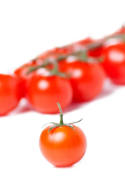 Juicy organic Cherry tomatoes isolated over white background — Stock Photo, Image