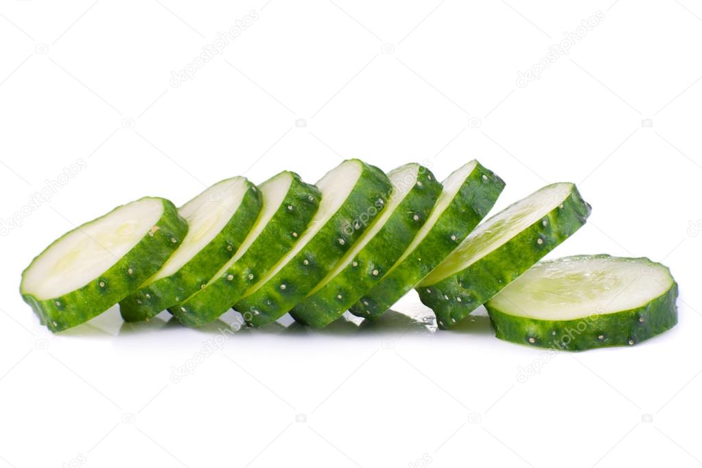 Stack of green cucumber slices with reflection isolated on white