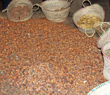 Argan fruits and shells from the manufacturing clipart