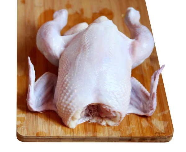 The whole chicken on the chopping board — Stock Photo, Image