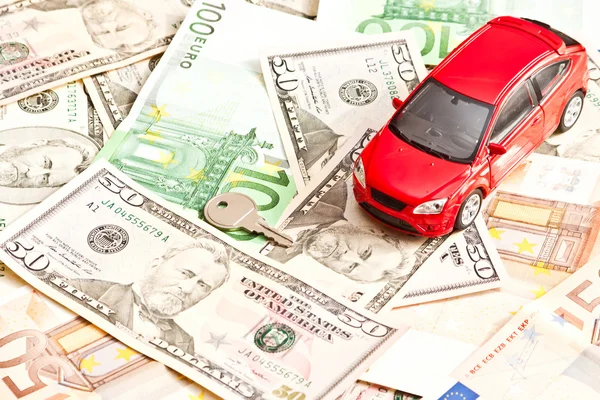 Toy car, key and money over white. Rent, buy or insurance car co — Stock Photo, Image