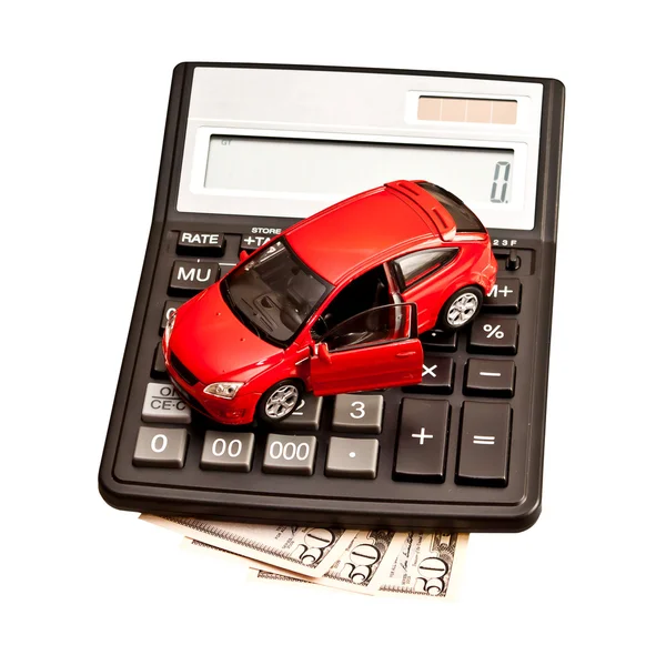 Carro de brinquedo e calculadora sobre branco. Conceito para comprar, alugar , — Fotografia de Stock