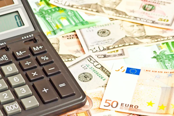 Business picture with money (dollar and euro) and calculator — Stock Photo, Image