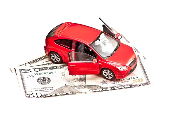 Speelgoedauto en geld over wit. huren, kopen of verzekering concept auto — Stockfoto